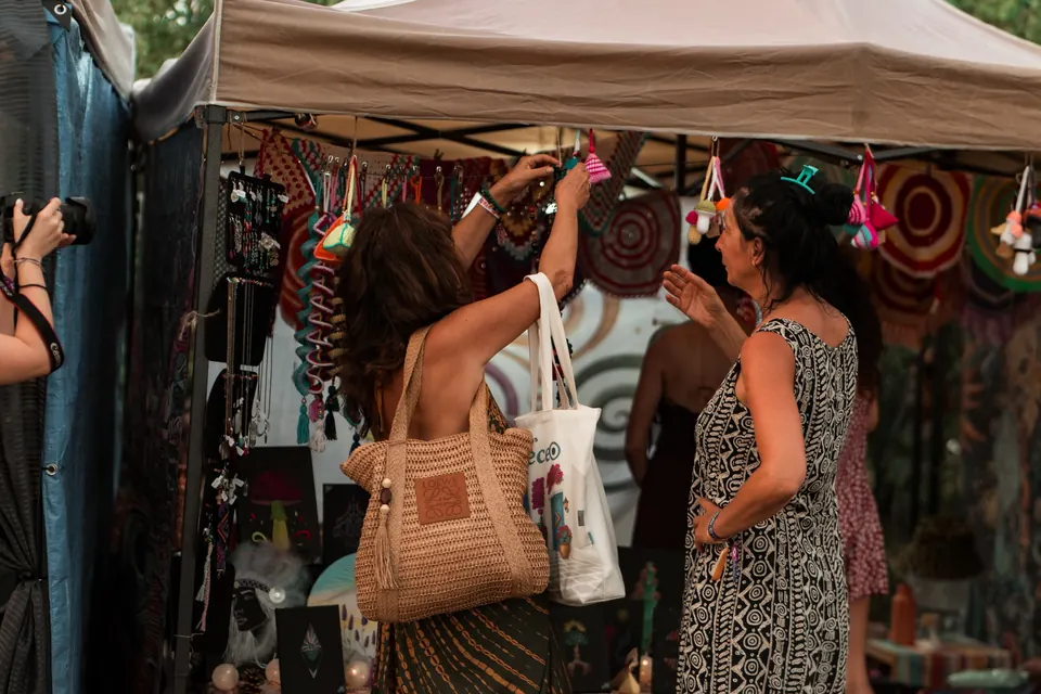 Browsing textiles at a Bazaar stall