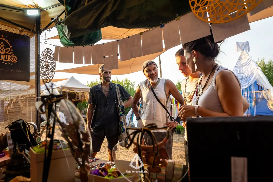 Vendors and visitors at a handmade jewellery stand in the Bazaar