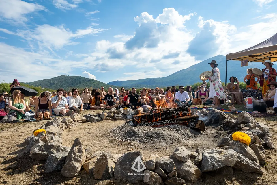 A large cacao ceremony around a stone circle below Rtanj