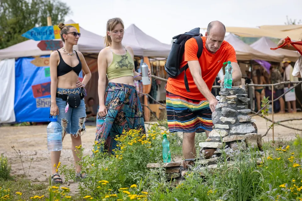 Festival-goers filling bottles at a water point