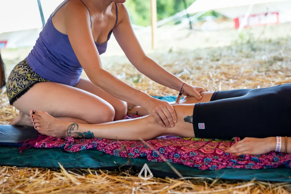 A bodywork session on a mat in the Healing Zone