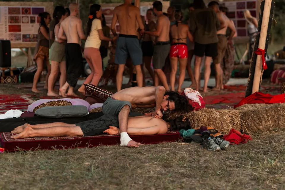 A massage on a rug in the Healing Zone