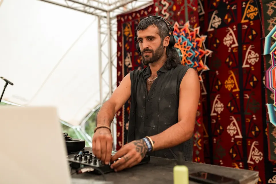 A producer at the desk on the TOK stage by day