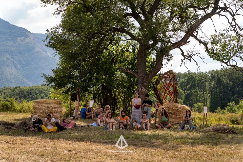 A cacao ceremony circle under the big oak tree