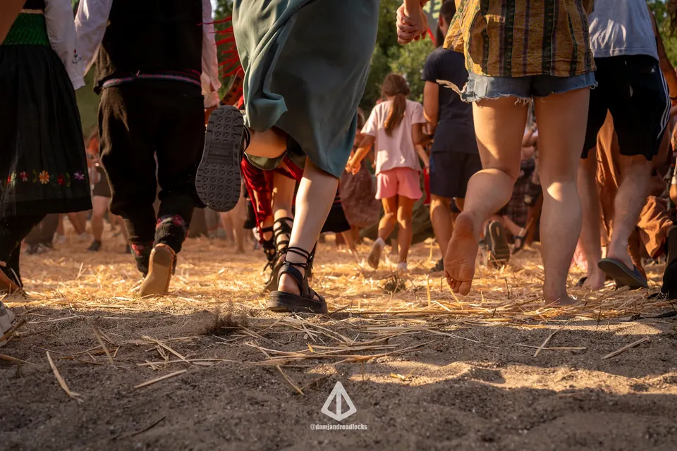 Barefoot dancers kicking up dust
