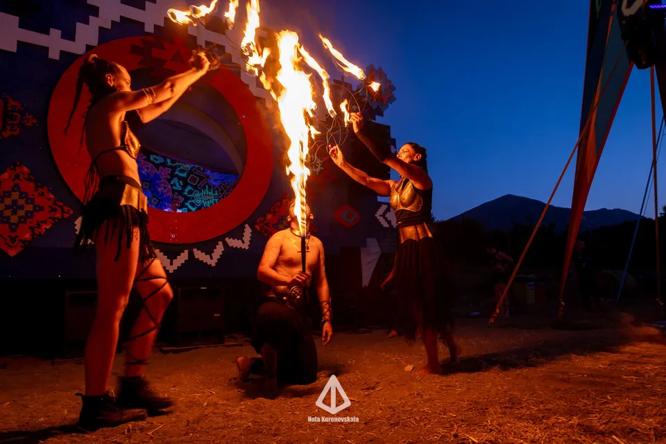 A performer spinning a fire hoop