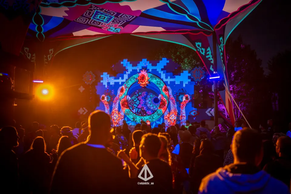 The KOLO stage glowing blue at night