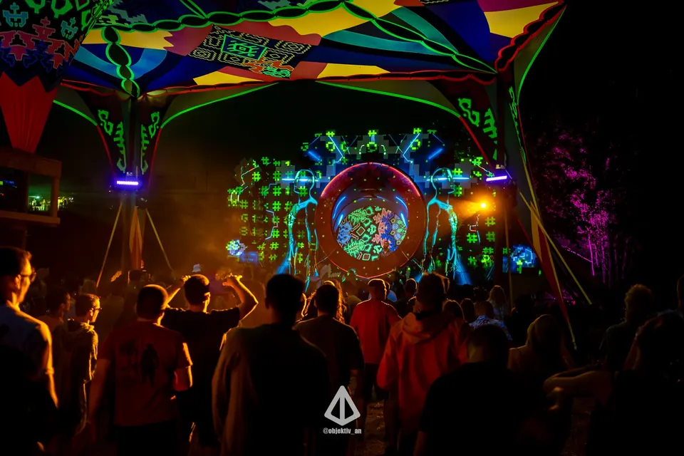 The crowd facing the mandala stage at night