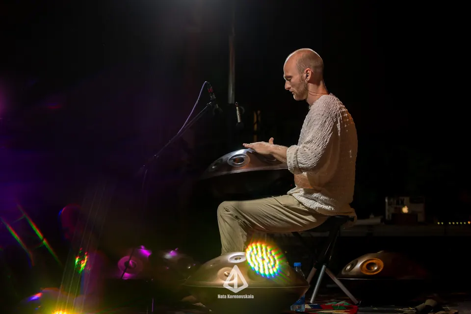 A pianist playing on stage at night