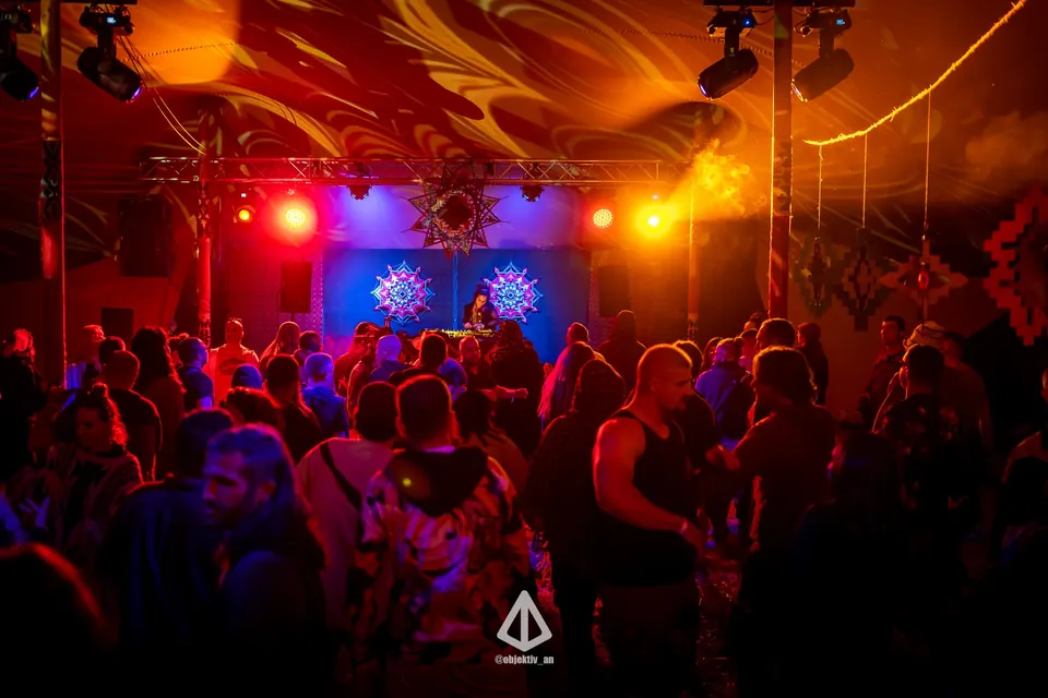 Dancers under red stage lights