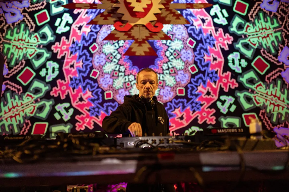 A DJ inside the UV mandala of the KOLO stage