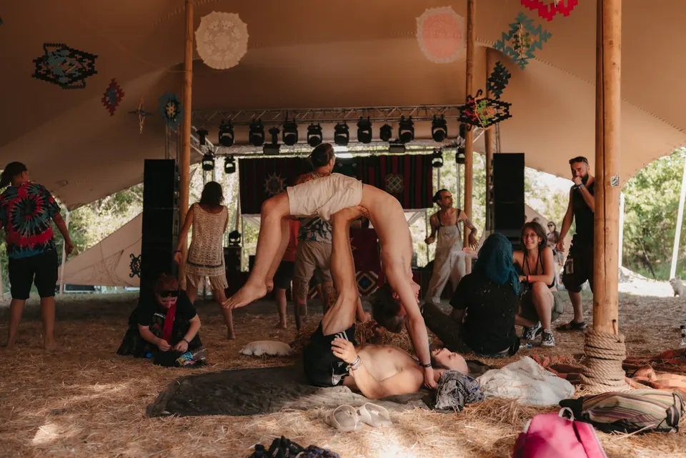 An acro session in the healing tent