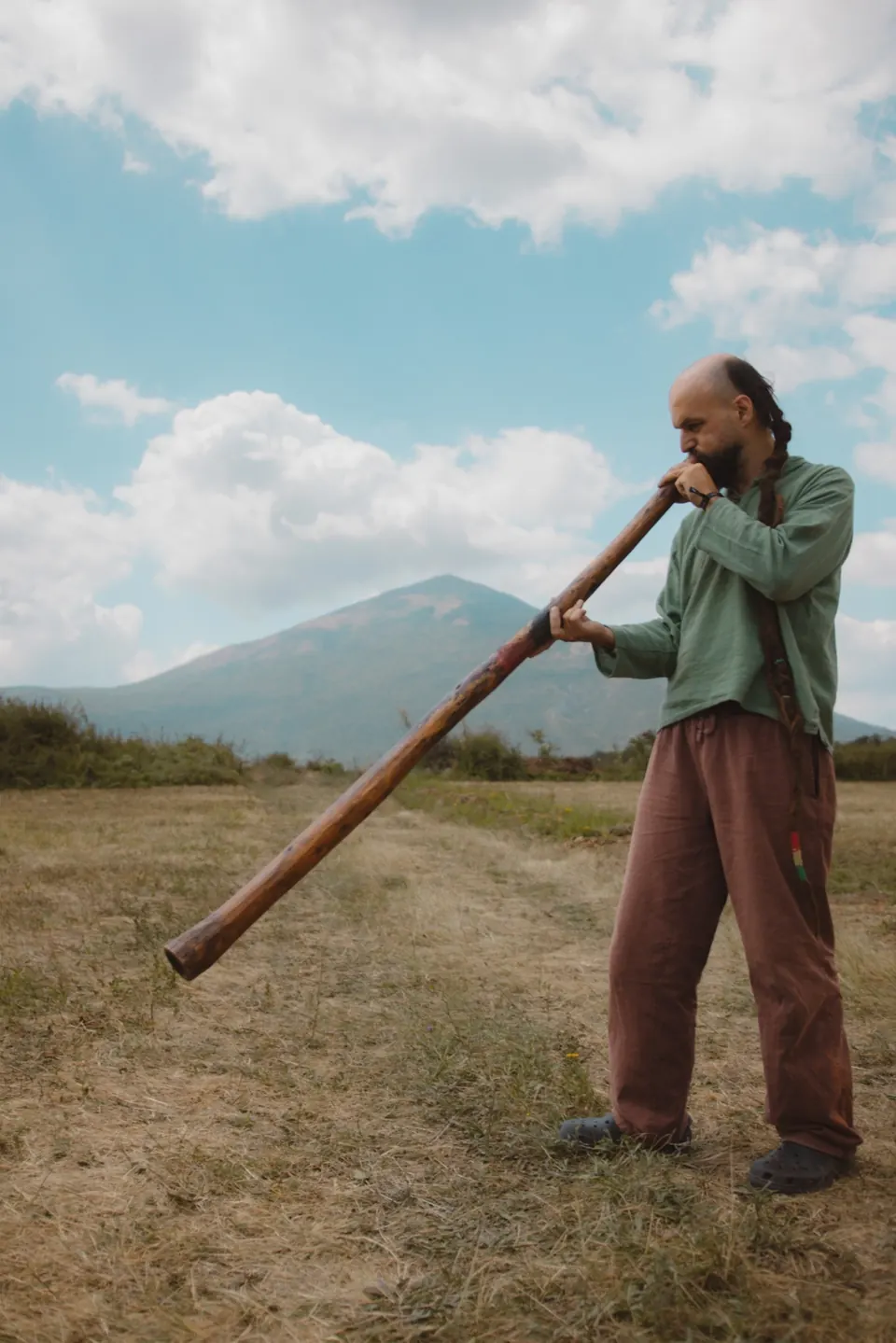 Playing the didgeridoo with Rtanj behind