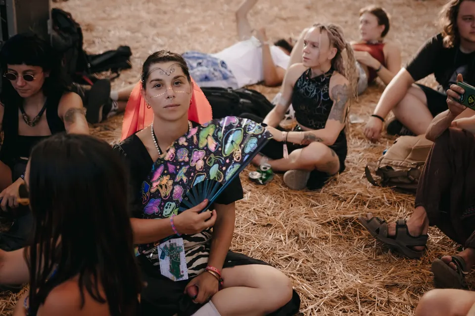 Dancers resting with fans