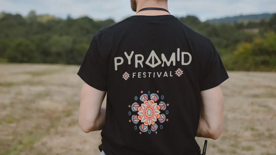 A Pyramid Festival T-shirt on the meadow
