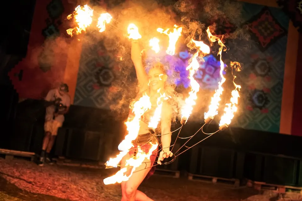 A performer with fire fans
