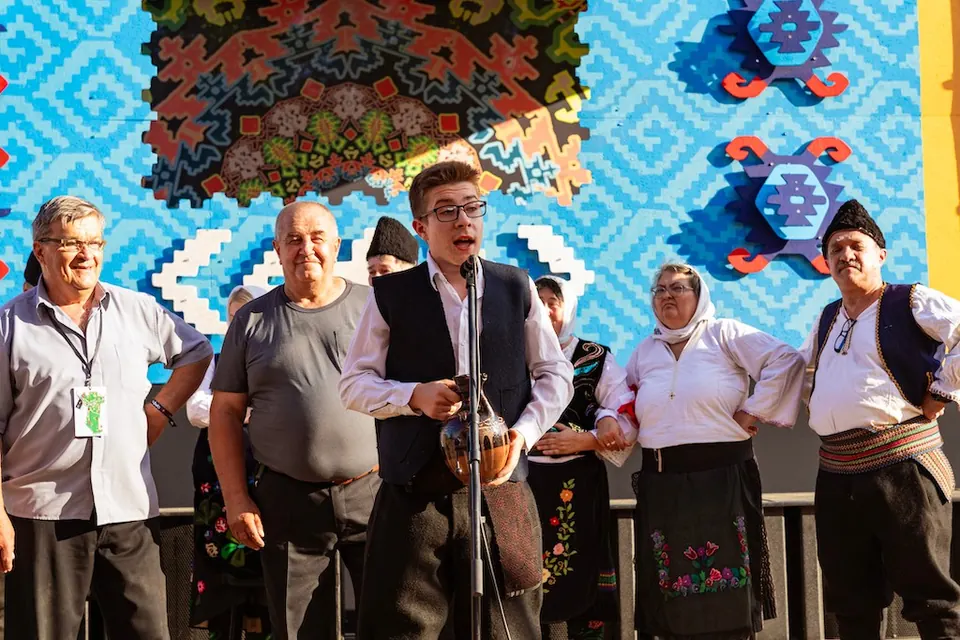 A folk choir singing on stage