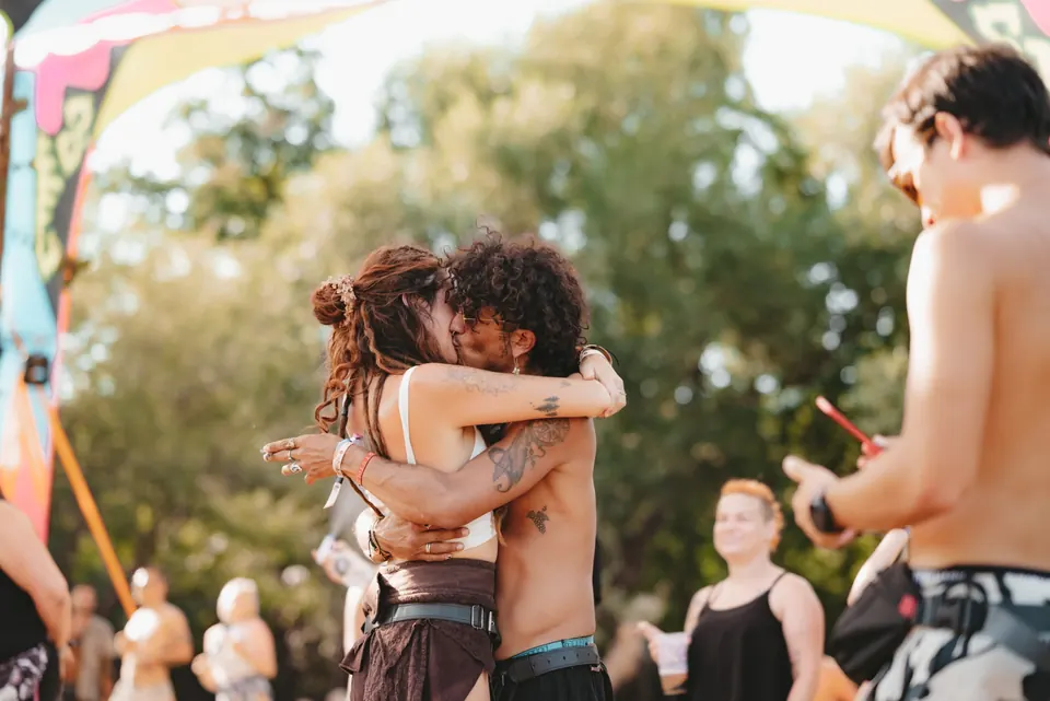 Friends embracing in the sun