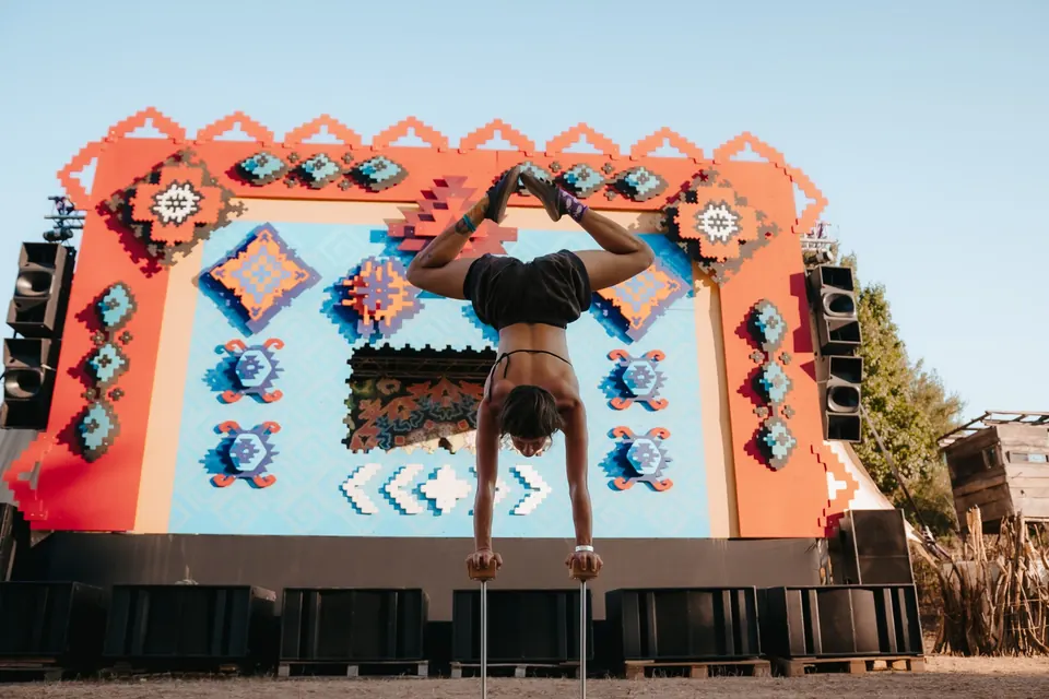 A handstand on the decorated stage