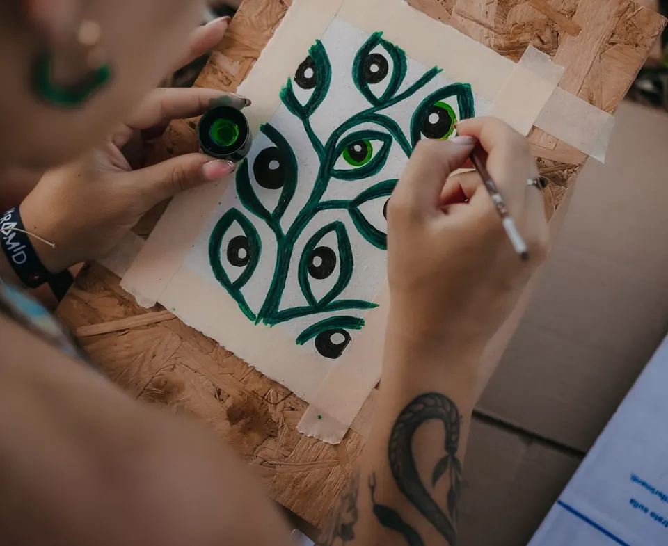 Hands painting at a workshop