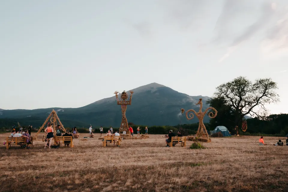 The meadow with sculptures and Rtanj behind