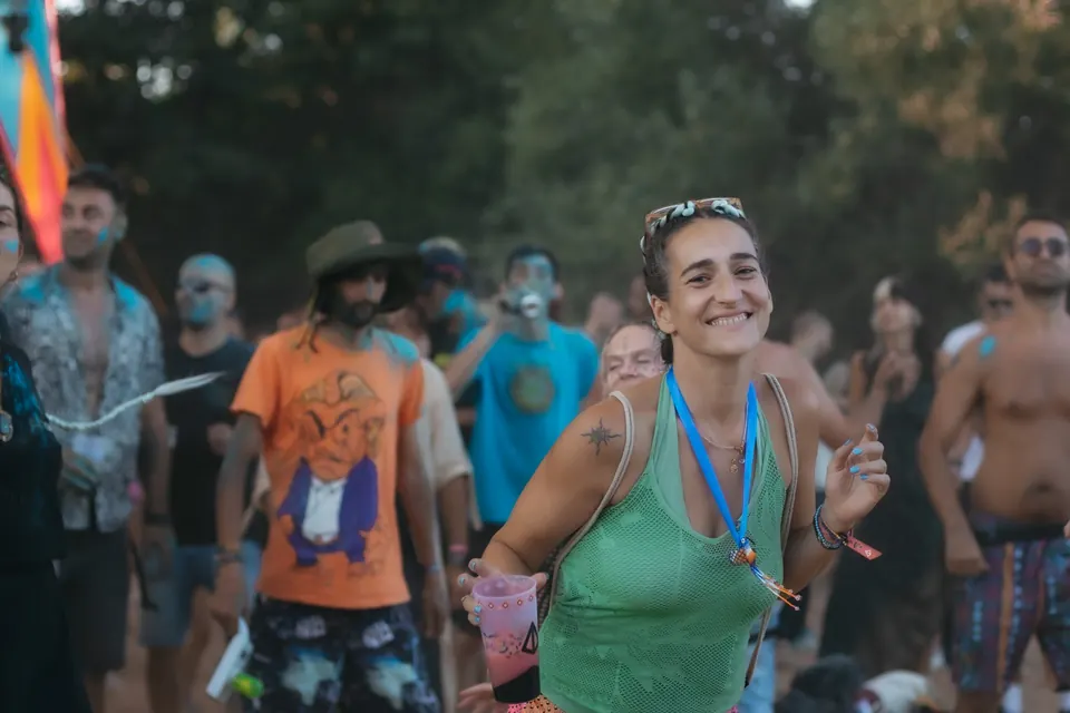 A smiling dancer in the crowd