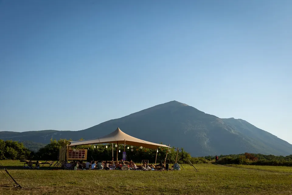 The Art Zone tent on the meadow below Rtanj