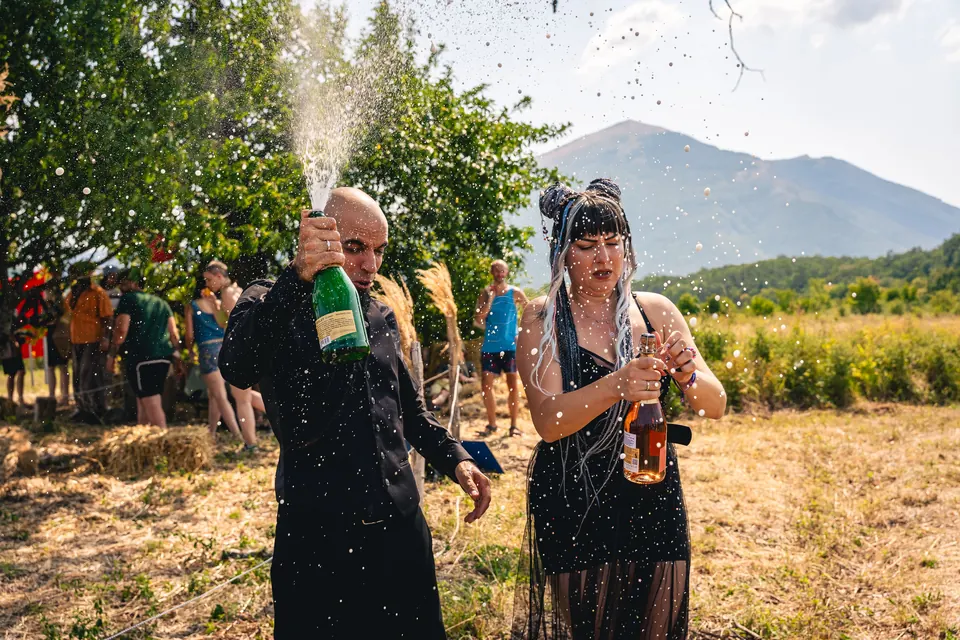 A celebration with sparkling wine in the meadow