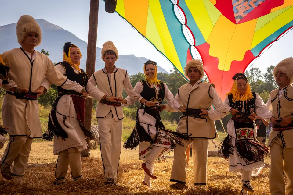 A folk ensemble dances the kolo at the opening