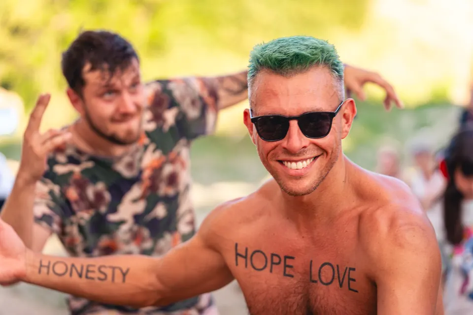 Friends with HOPE, LOVE, HONESTY painted on their skin