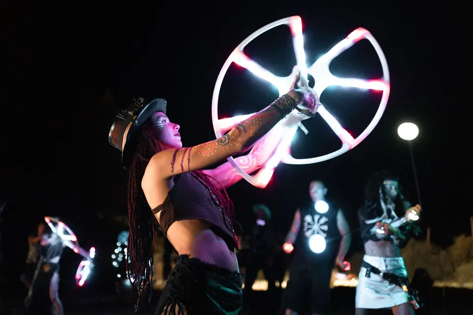 An LED wheel performer at night