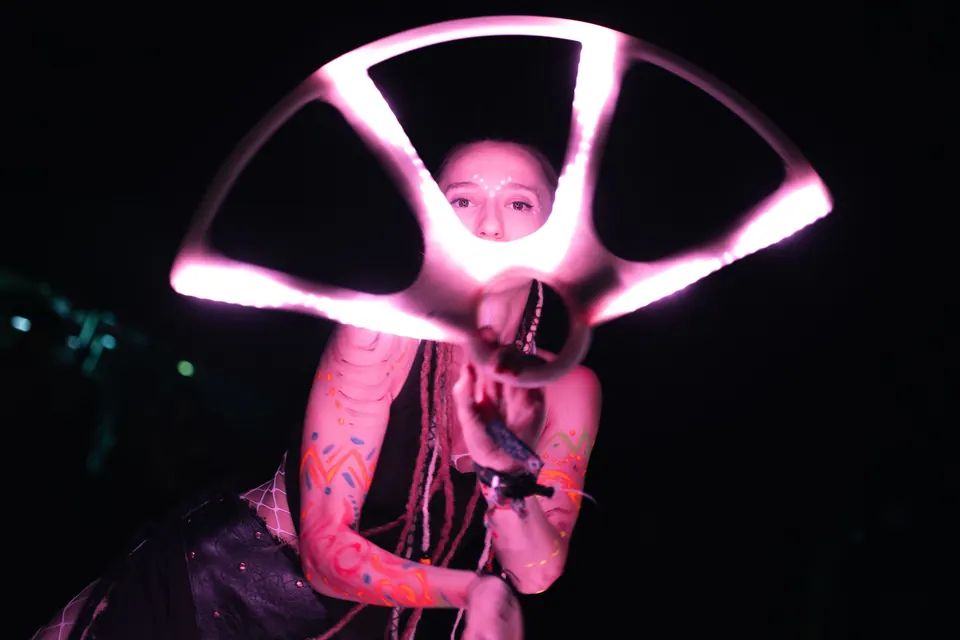 A portrait inside a pink LED wheel