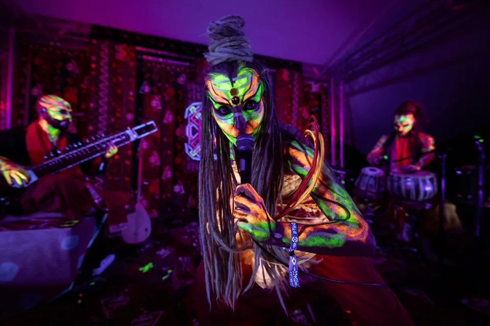 A UV-painted musician on stage