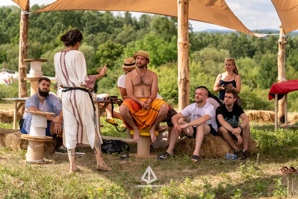 A talk in the shade tent of the Workshop Zone