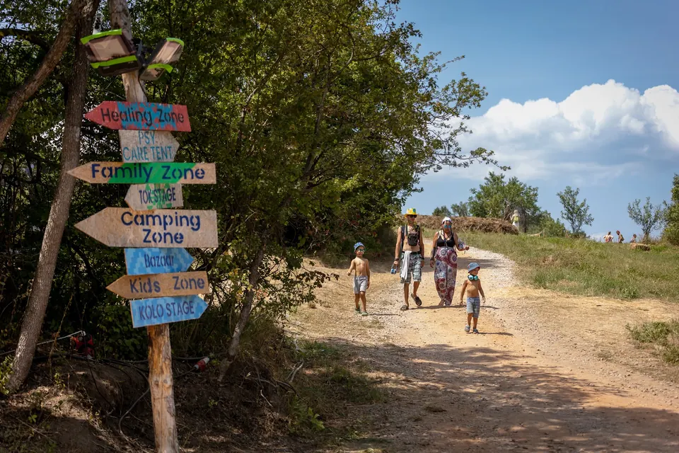 Signpost to the Healing Zone, Family Zone, camping and Kids Zone